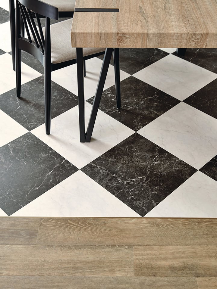 Amtico's Nero Classic Marble and Bianca Classic Marble in a Checkerboard laying pattern, paired with Hackfall Oak.