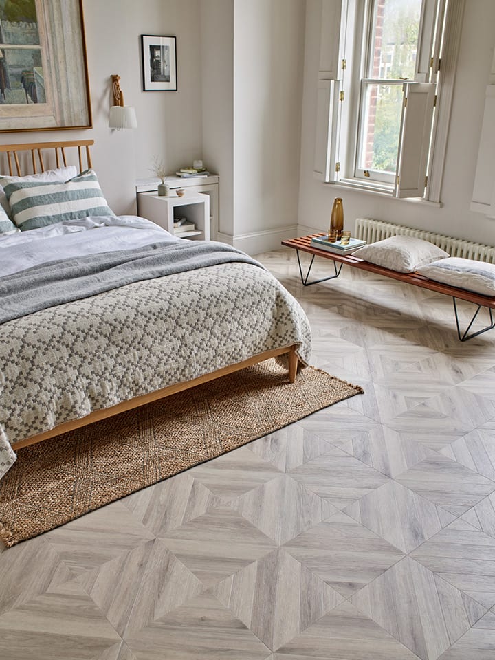 Bedroom floor features Amtico's Wharncliffe Oak in Gable Parquet.
