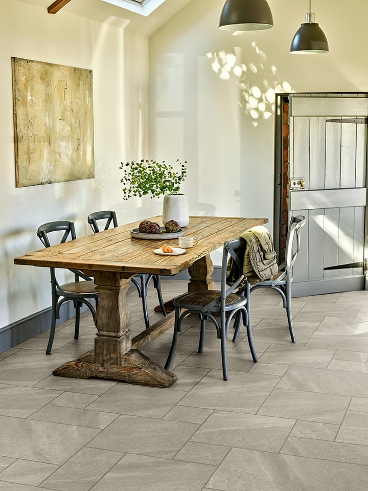 Dining room features Whitley Stone in Extra Large Flagstone.