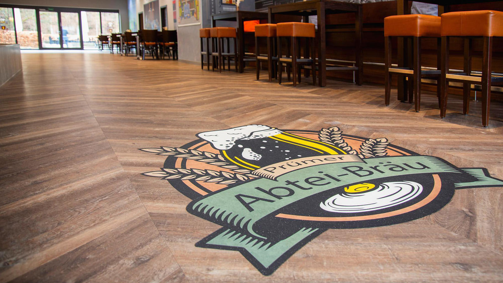 A custom-made logo is incorporated into the brewery's floor using products from Amtico Signature collection.