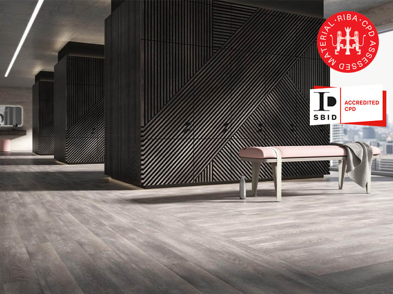 Grey Amtico LVT flooring in a large modern room with large windows