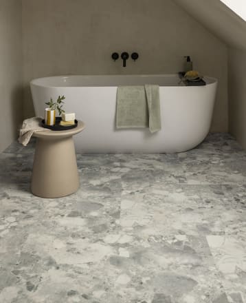 Bathroom flooring features Amtico's Piazza Montara in Broken Bond, from the Amtico Spacia collection.