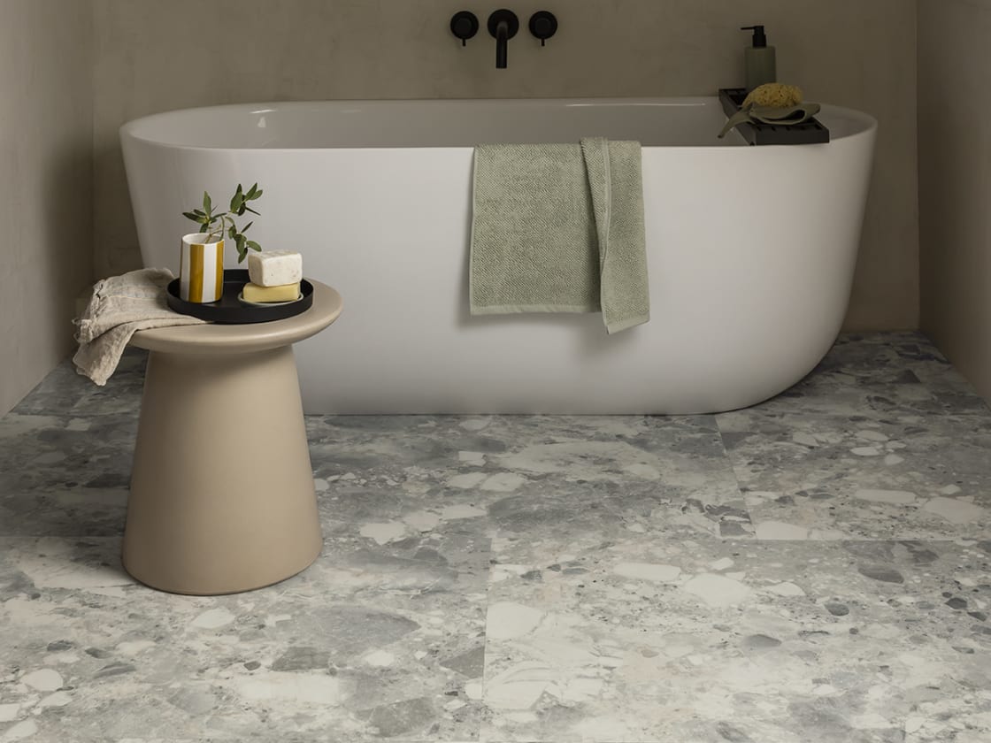 Bathroom flooring features Piazza Montara in a Broken Bond laying pattern.