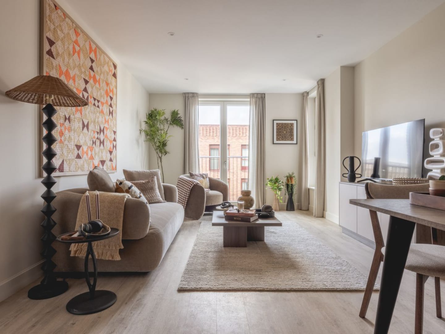 The apartment features Springtide Oak in Amtico First Acoustic, laid in Stripwood.