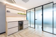 Office corridor features Natural Limed Wood in a Herringbone Plank pattern.