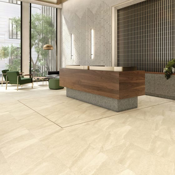 Office reception area features AR0SMA31 Blockley Stone in Broken Bond with Polished Gold stripping.