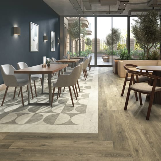 Hotel restaurant features DC563 Lune Large with Onyx Marble and Hamsterley Oak.