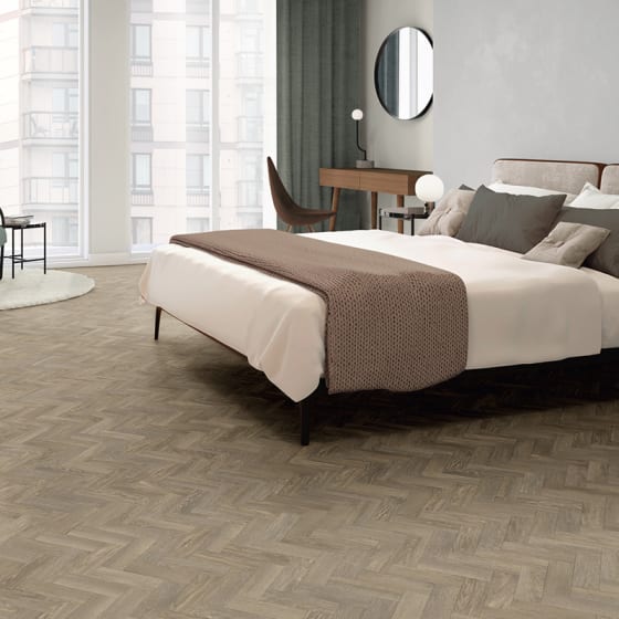 Hotel bedroom features Bergen Oak in Small Parquet, from the Amtico Form collection.