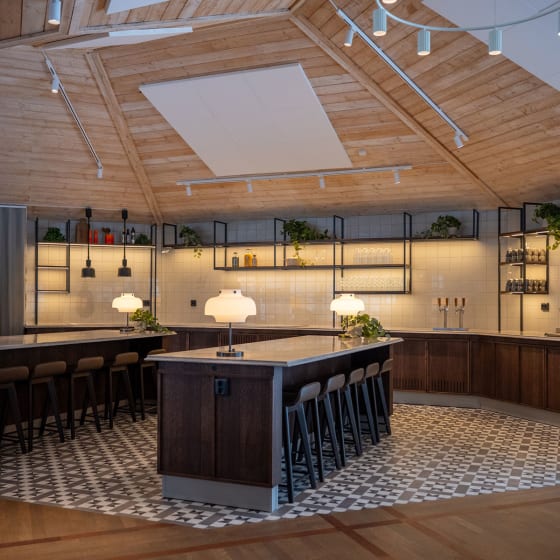 Hotel bar featuring Classic Argent from the Amtico Décor collection creating an eye-catching zoned space.