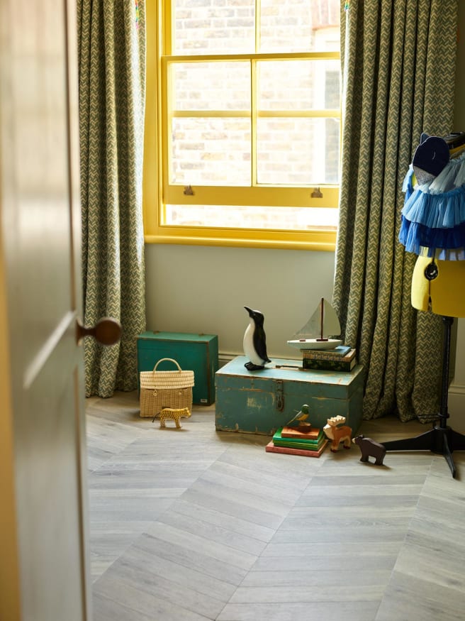 Amtico Henley Oak in Chevron adds a contemporary twist to this Georgian-style home, paired with bright pops of colour.