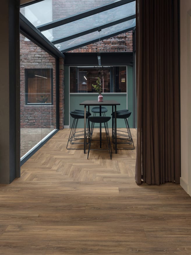 Wenlock Oak in Large Parquet brings warmth and comfort to the communal space.