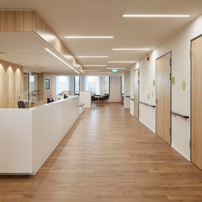 The hospital floor features Brushed Oak from the Amtico Signature collection.