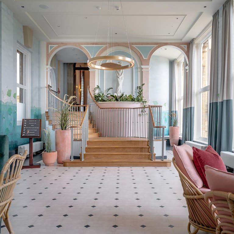 The hotel floor features Stucco Quartz and Stucco Flax laid in Key Stone Small, from the Amtico Signature collection.