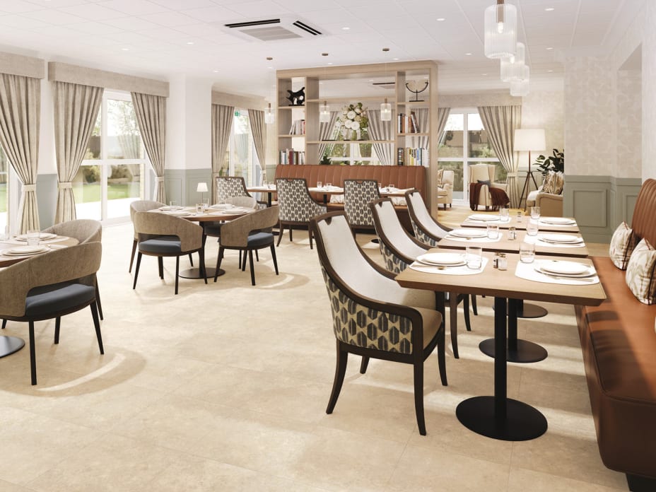 A bright and elegant communal dining space with a calm, residential feel, featuring Agora Limestone in a Uniform Tile laying pattern.