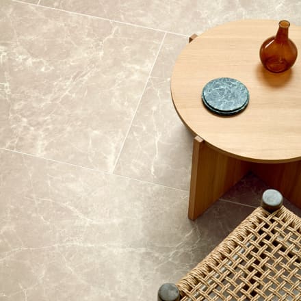 Light, bright beige marbled flooring in large tiles