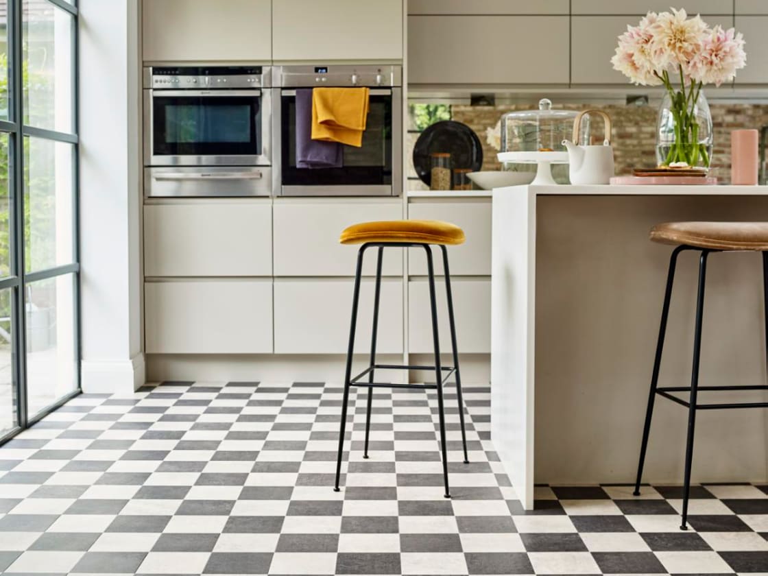 Kitchen with timeless blank and white check flooring