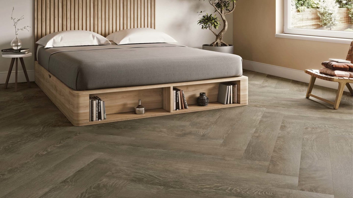 LVT Flooring - Kalmar Oak in a bedroom, laid in a Herringbone plank pattern