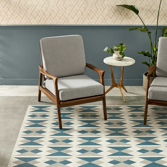 Stone-effect floor tiles in a geometric diamond pattern in grey, white and blue tones