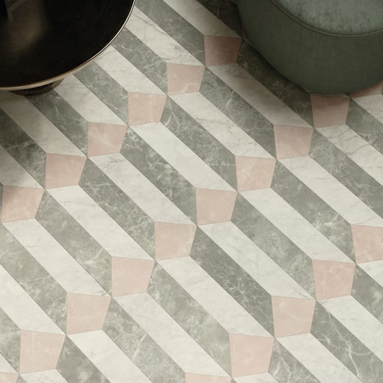 Marble-effect floor tiles in grey, white and blush pink tones in a venetian parquet pattern