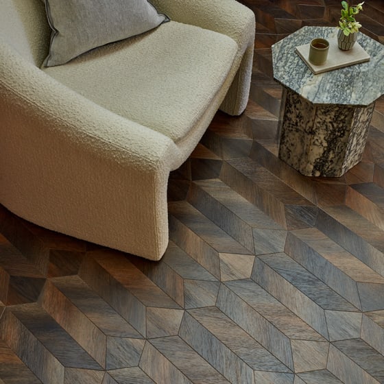 Dark, rich wood-effect floor planks in a venetian parquet pattern