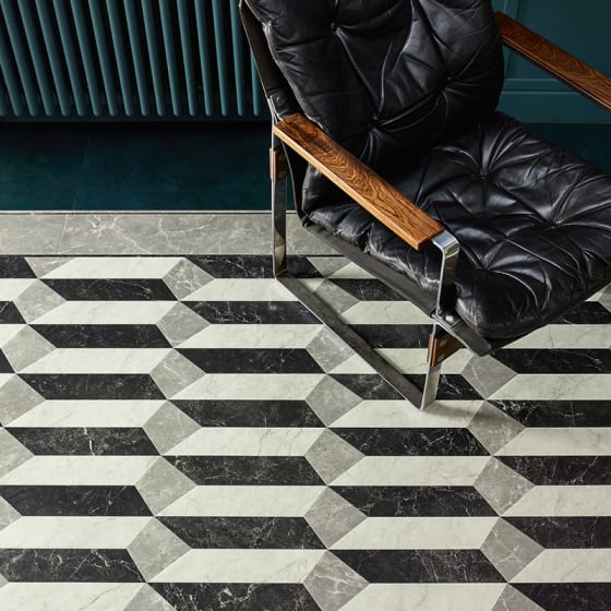 Marble-effect floor tiles in grey tones and a venetian parquet pattern