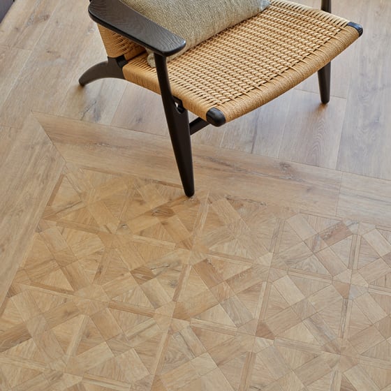 Sandy-coloured small wood-effect floor planks in a lattice pattern