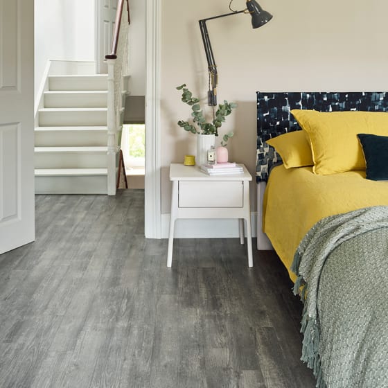 Bedroom floor features Drift Pine in Stripwood pattern