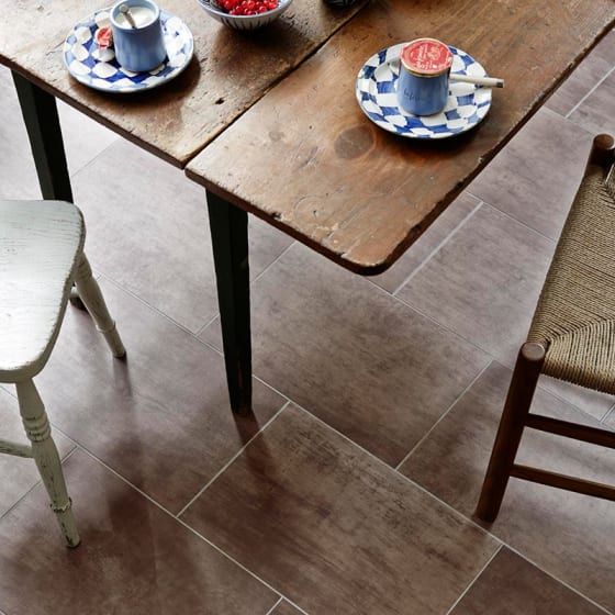 Bronze dining room floor tiles in broken bond pattern