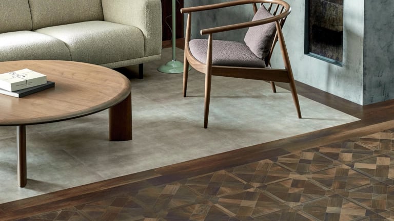 Rich wood-effect small floor planks in a lattice pattern next to concrete-effect floor tiles